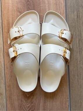 Birkenstock Arizona EVA Sandals in Cream with Gold Buckles